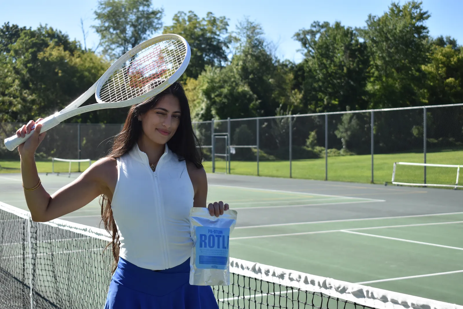 Founder with racket and rotli pouch